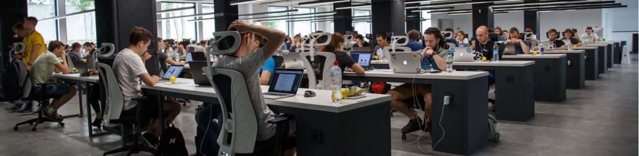 large workplace filled with employees at desks