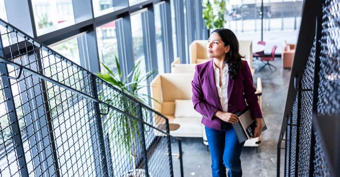 woman walking stairs large 2560 x 1338