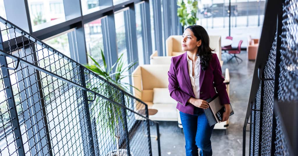 woman walking stairs large 2560 x 1338